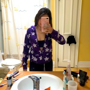 purple sweater with black and white stars